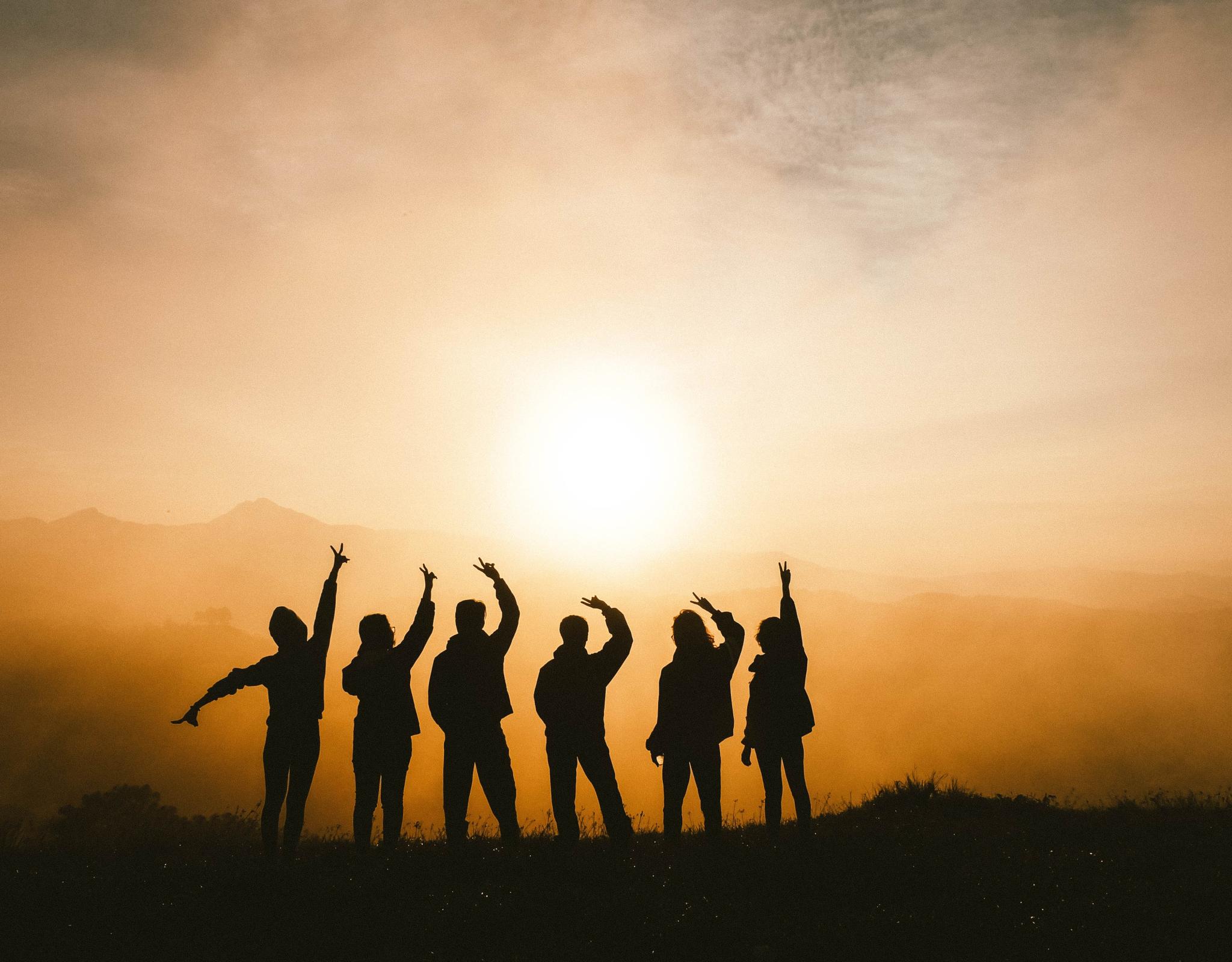 teens against the backdrop of a sunset