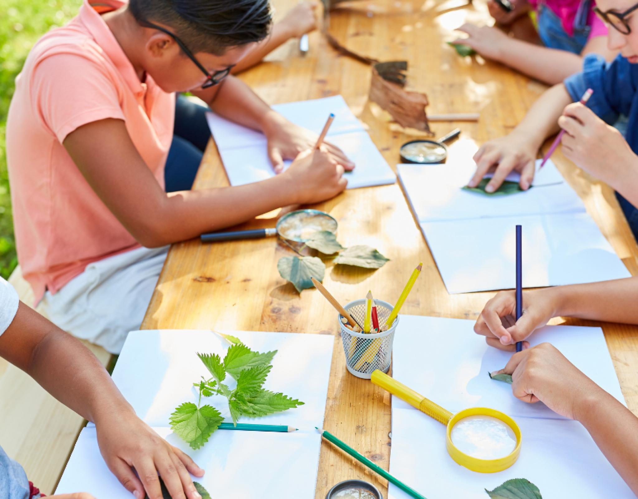 Kids at a picnic table making art