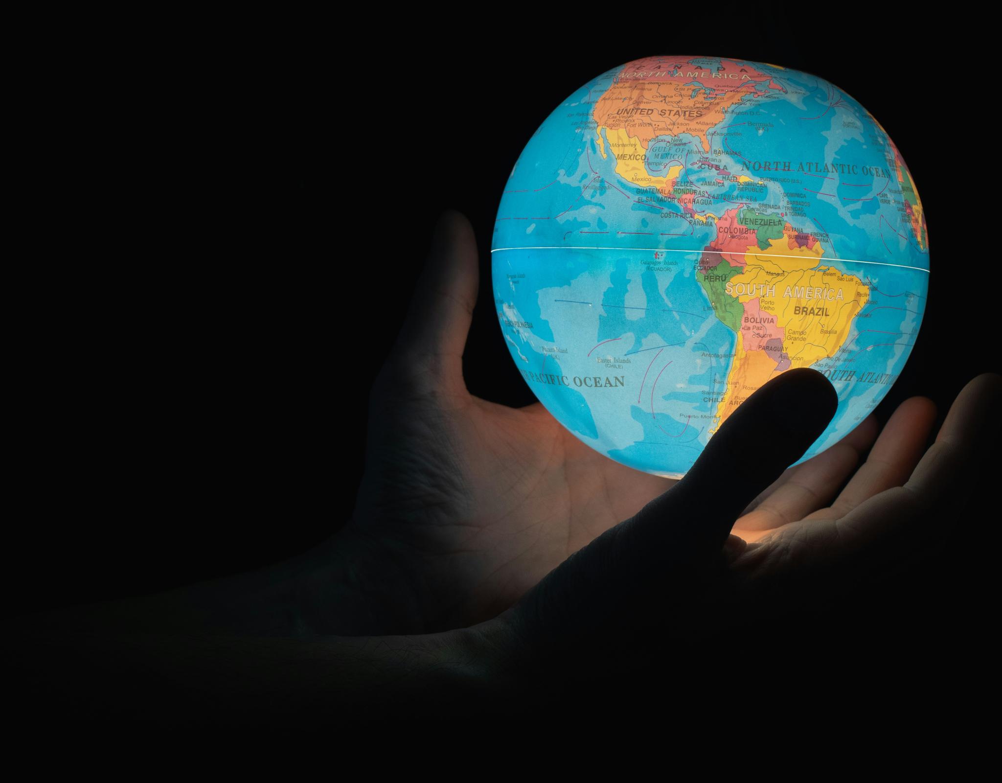 Hands holding world