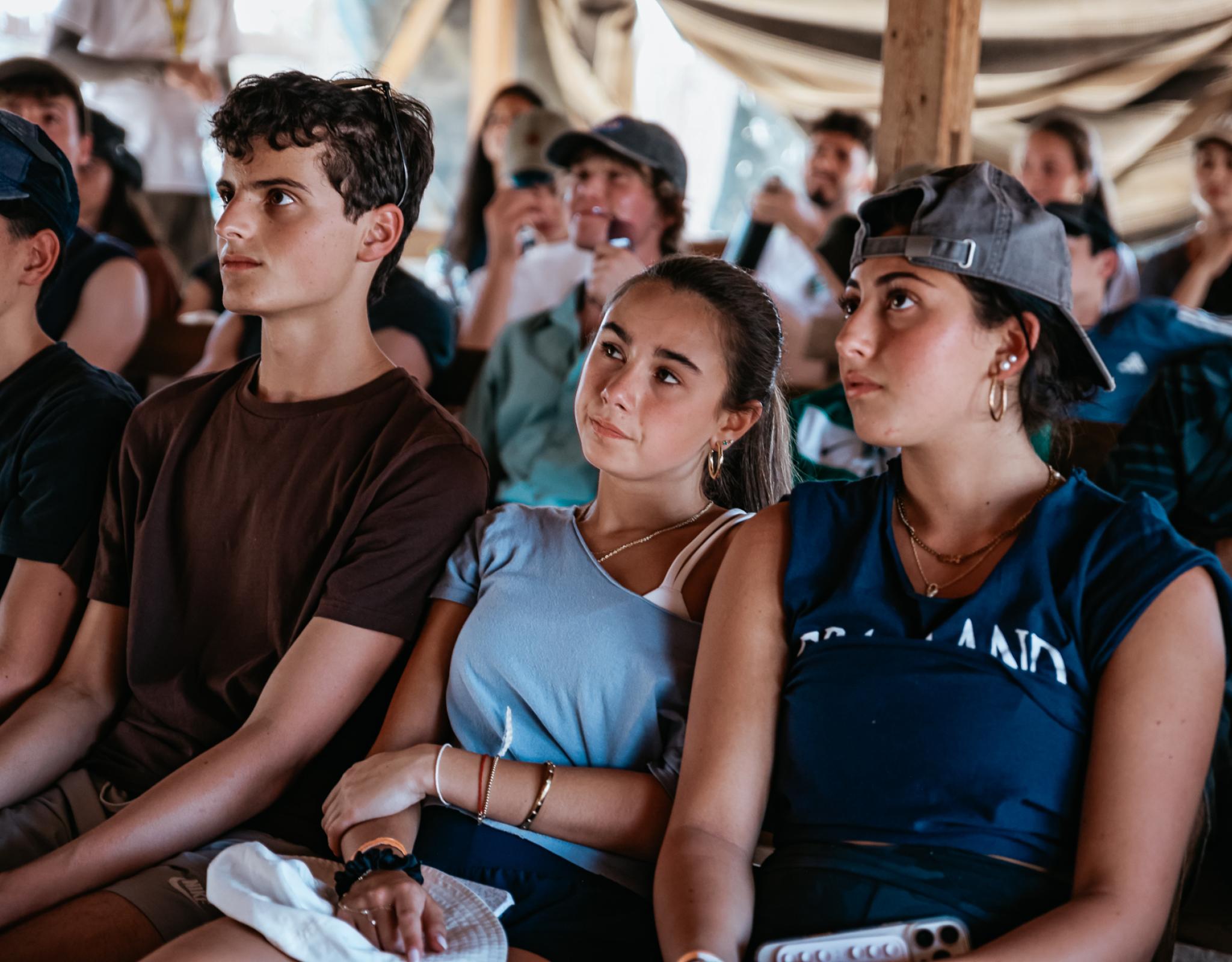Teens listening to a session
