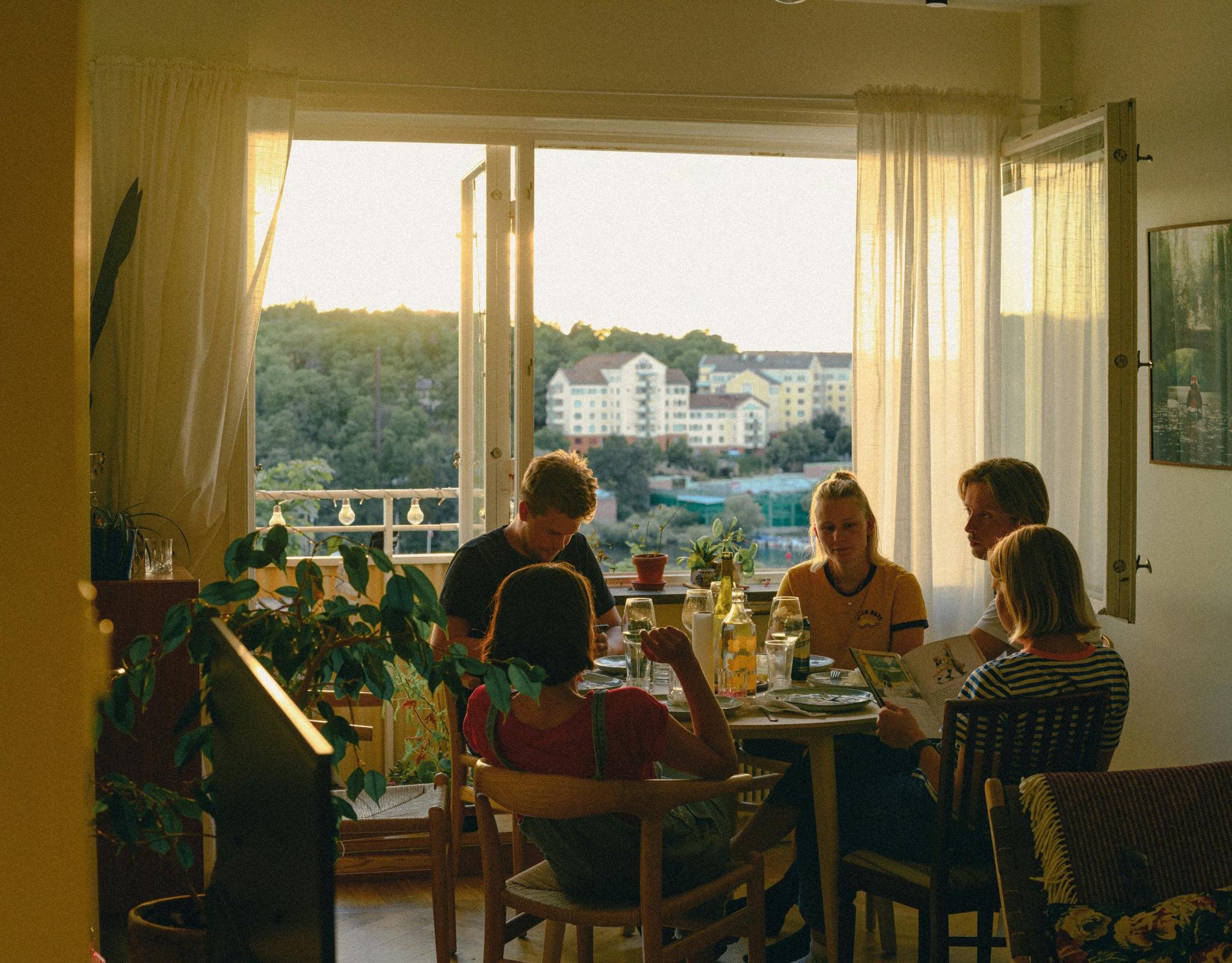 Young adults eating dinner