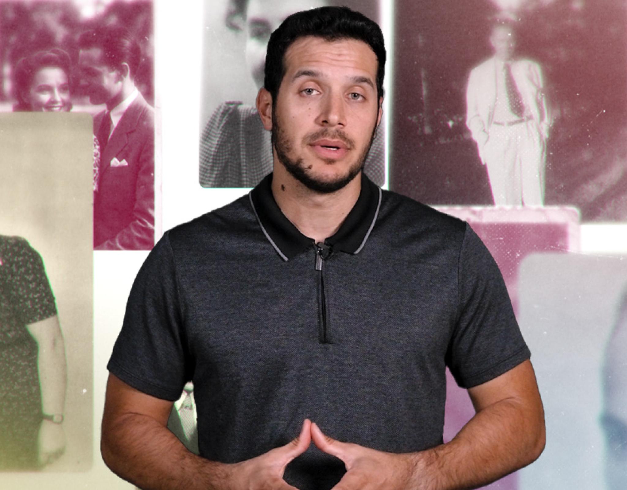 Man standing in front of photographs of individuals from the 40s