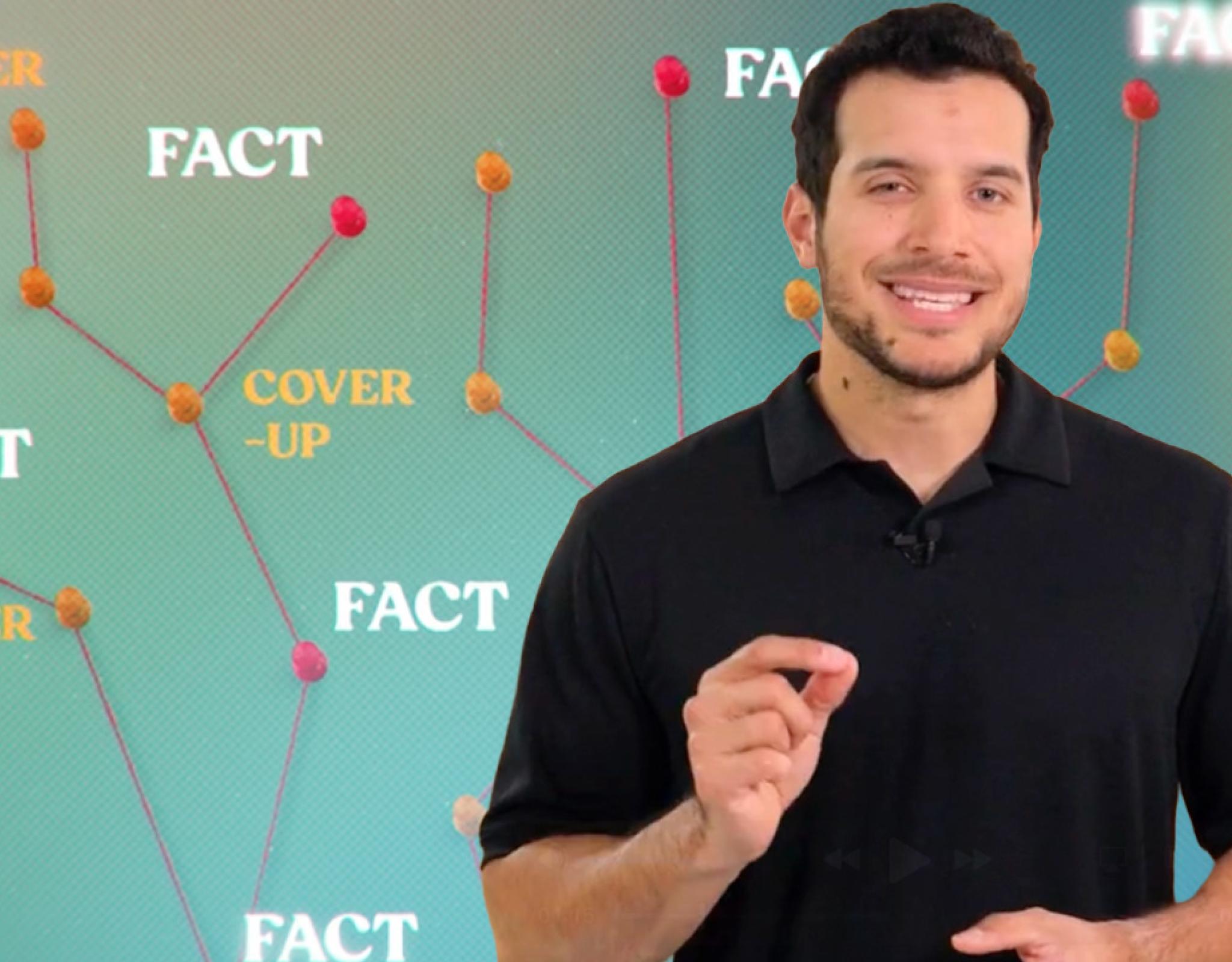 Man standing in front of web of words that say "fact" and "cover-up"