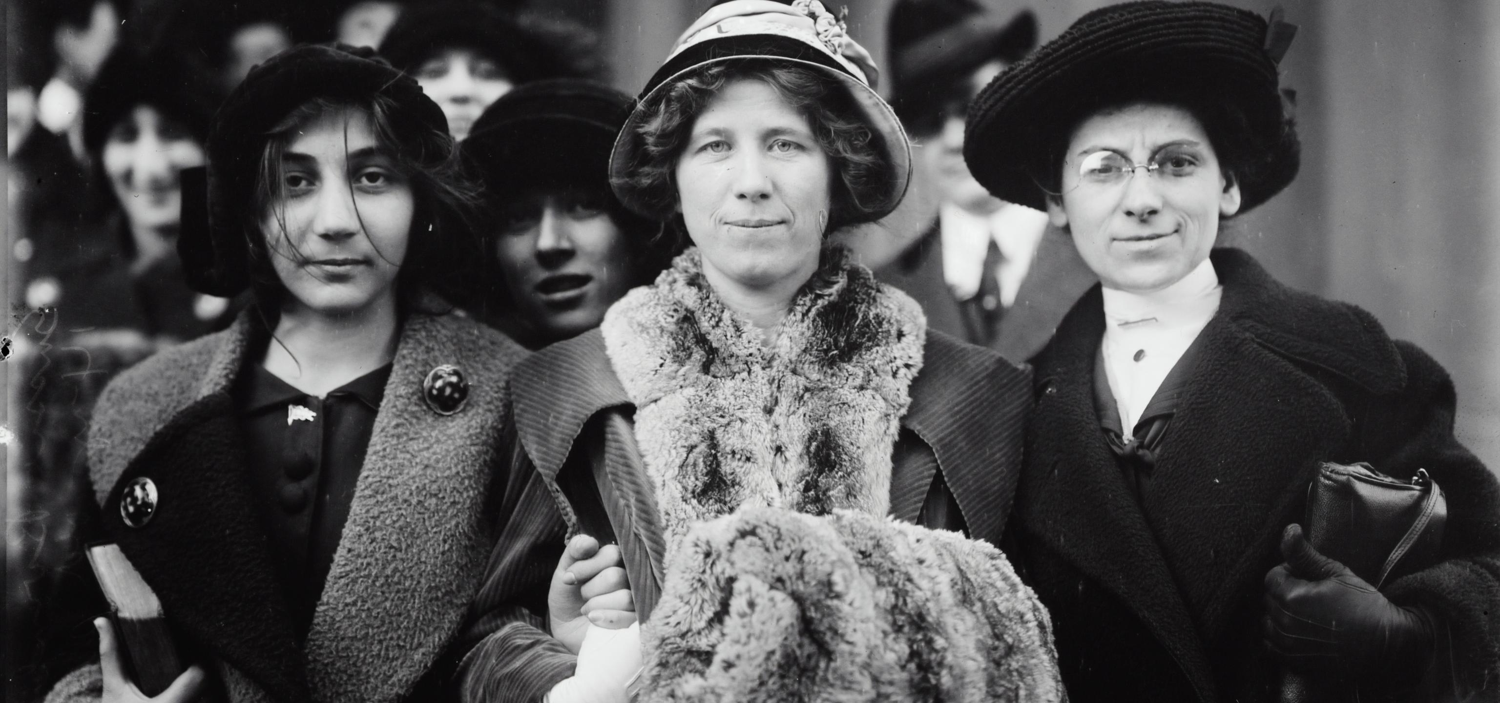Suffragettes standing together during strike