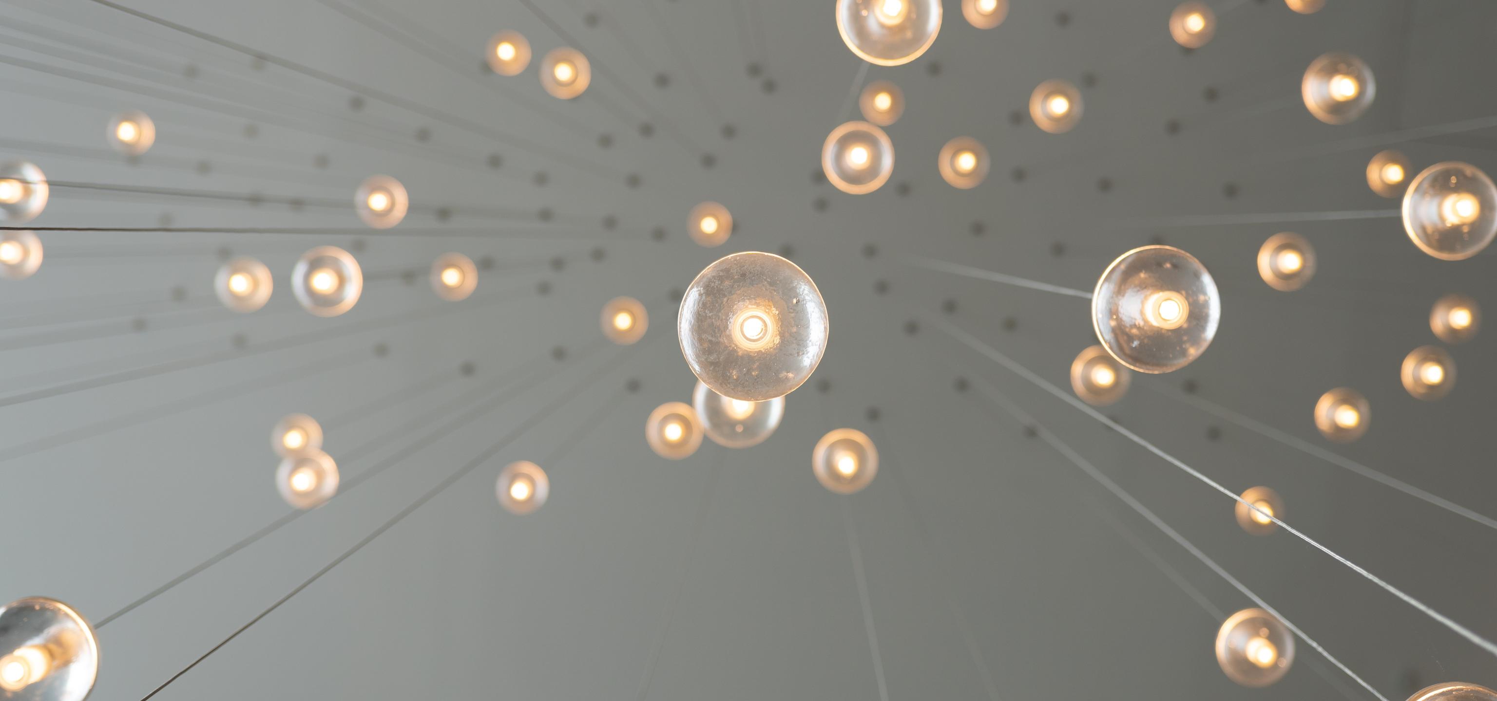 Lightbulbs suspended from ceiling