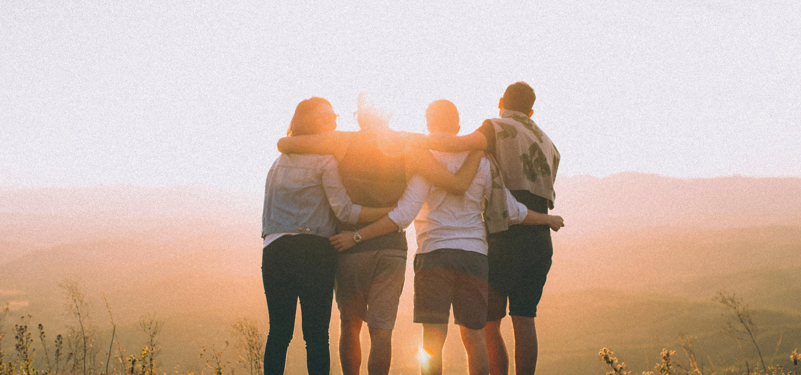 teens with arms around one another