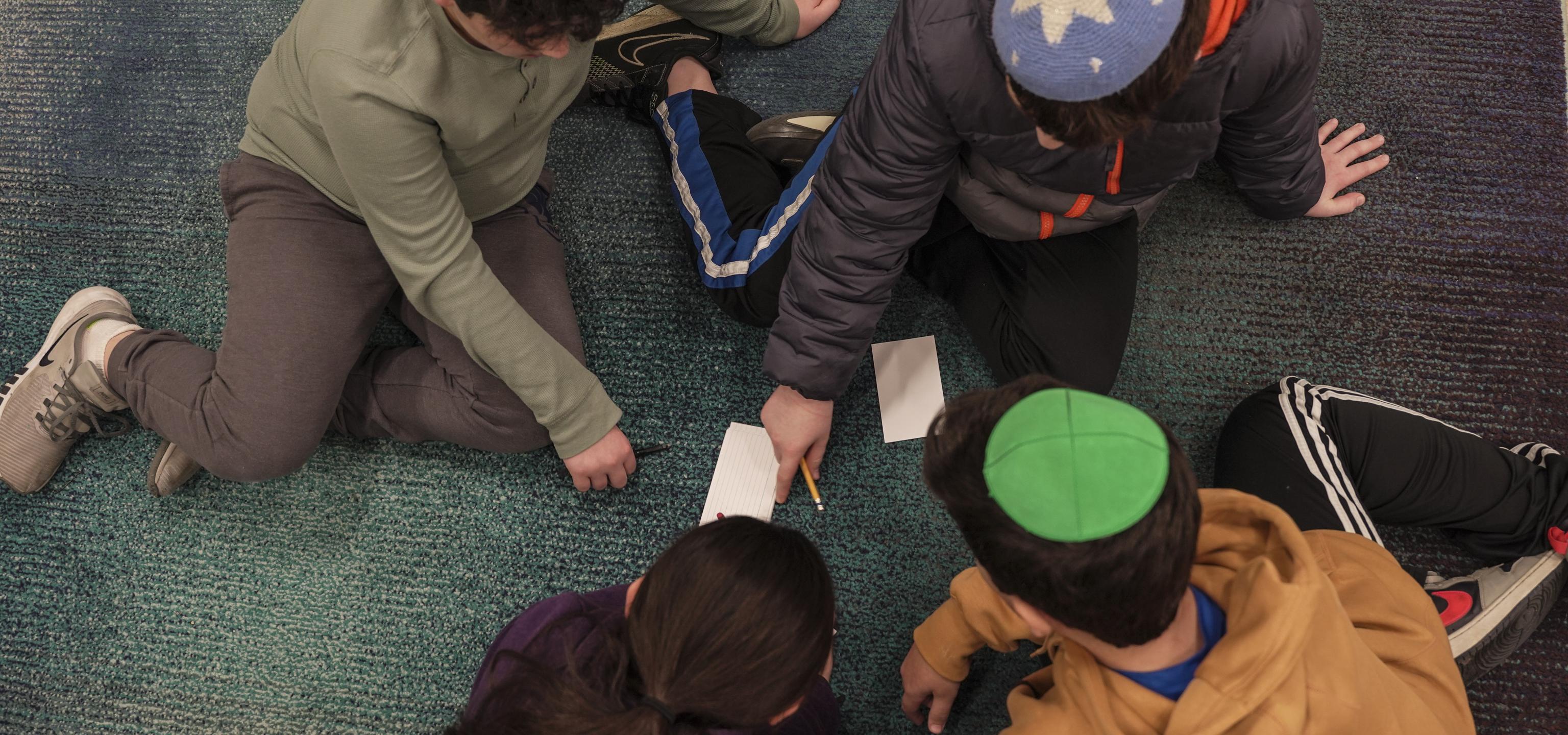 A group of children studying together.