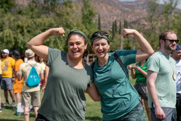 Adults dressed in green