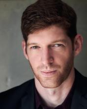 omri rose headshot in black shirt