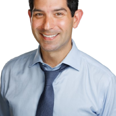 A headshot of Dan in front of a white background.