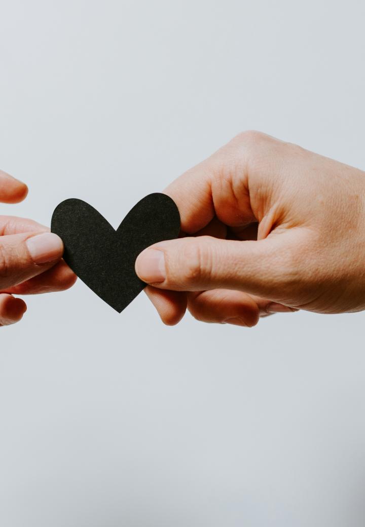 reaching out hands heart