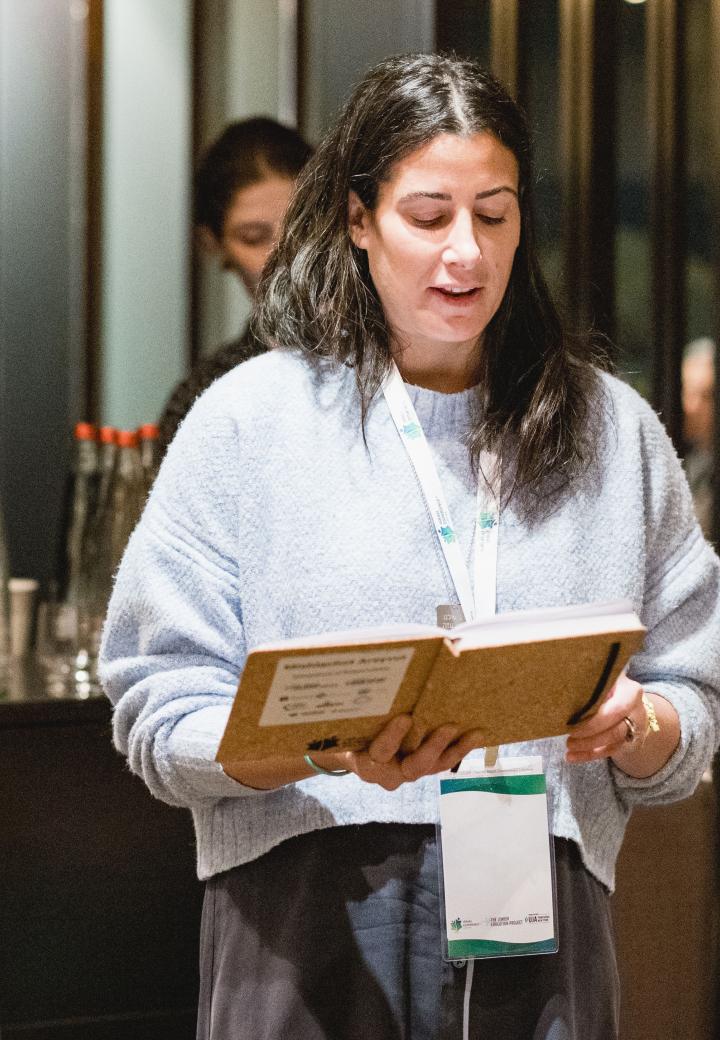 woman reading from a book